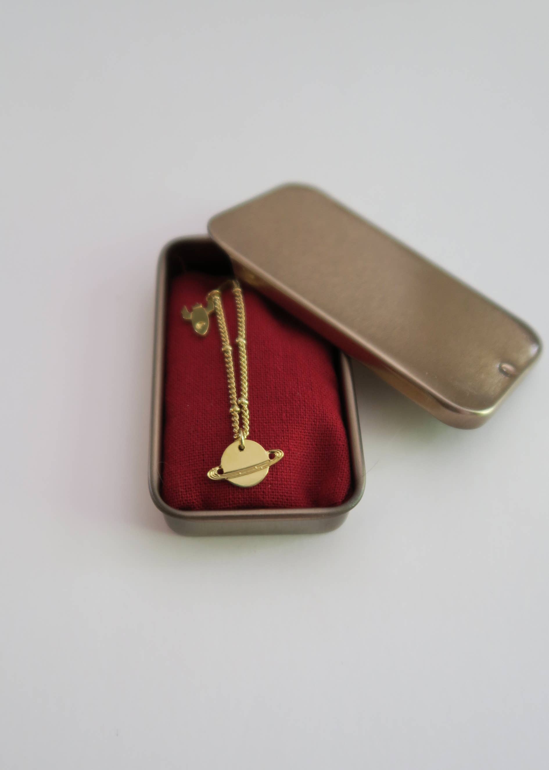 Yellow gold Mini planet Saturn and mini rocket necklace for wholesale on Faire3