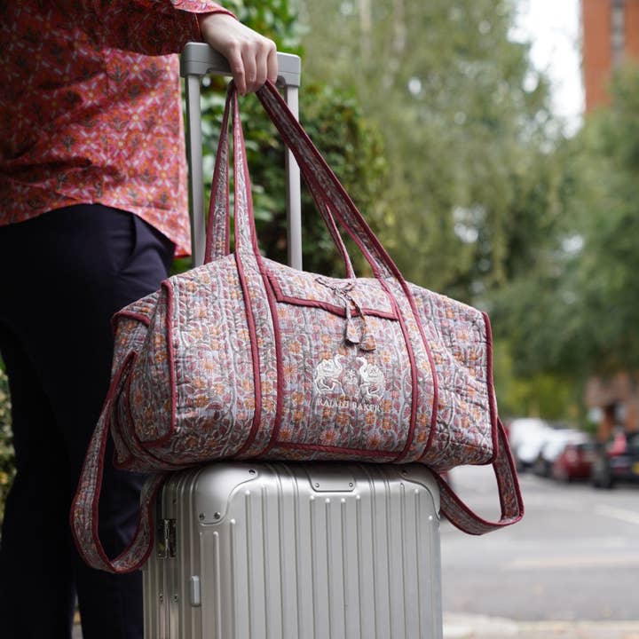 Gayatri Duffle in Cranberry Blooms for wholesale by Rajani Baker
