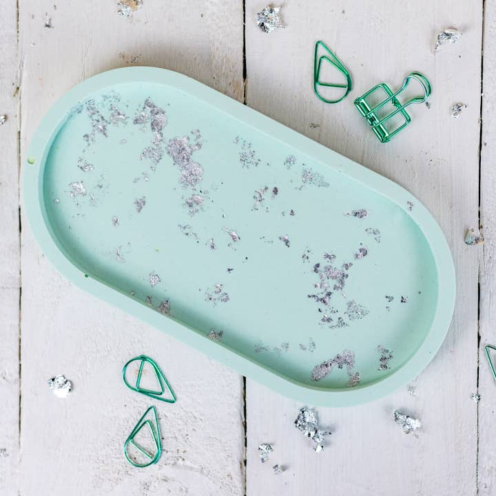 Jesmonite oval trinket tray, pastel green with silver leaf for wholesale by Nine Angels