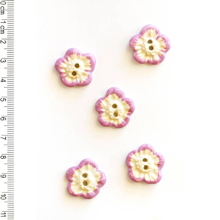 White Flower with Pink Petal Edges Sewing Buttons for wholesale by Incomparable Buttons