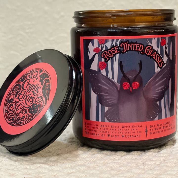 Rose Tinted Glasses Mothman Cinnamon Rose Scented Soy Candle for wholesale by Cryptic Paper Co.