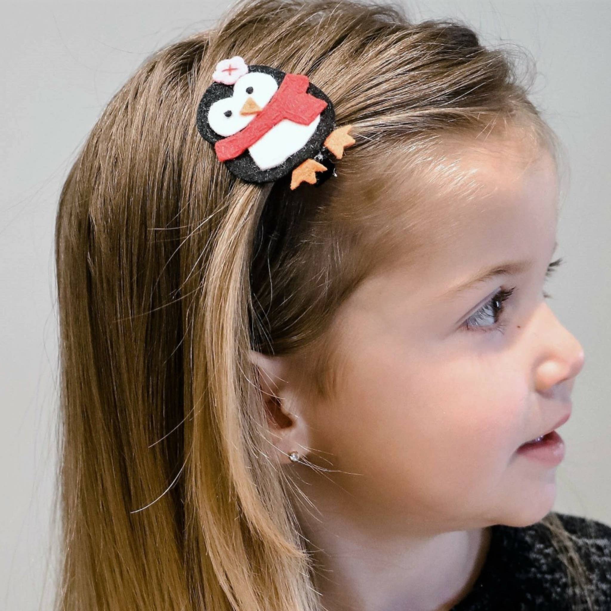 Black Holly Penguin Felt Novelty Hair Clip for wholesale on Faire1