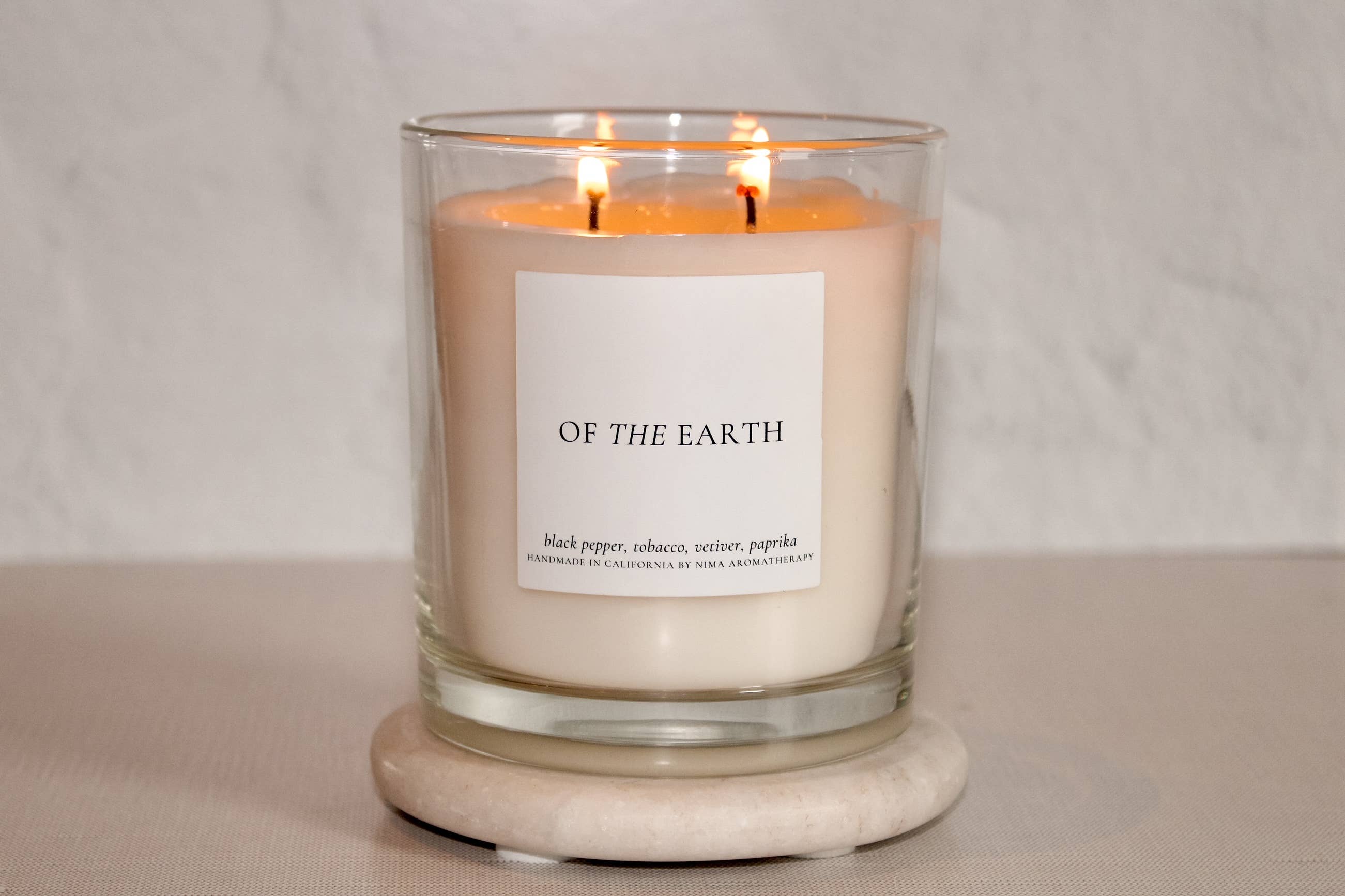 NIMA aromatherapy - Wholesale Jar/Filled Candle - Palo Santo + Tobacco - 12 oz clear jar soy wax candle1