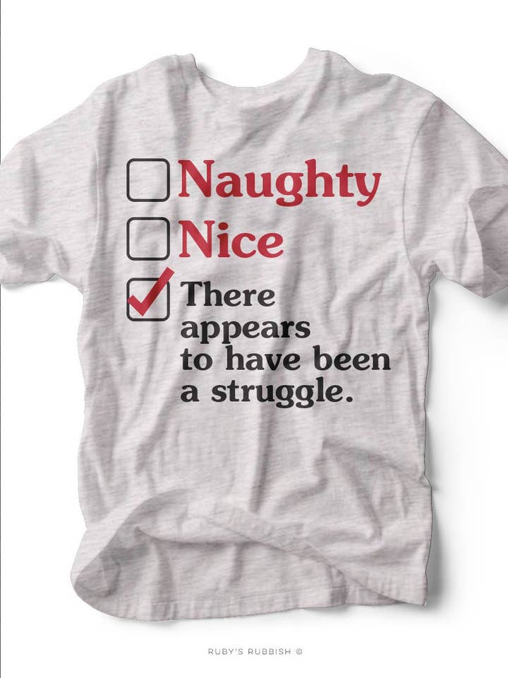 Naughty Or Nice | T-Shirt Sazonal | Ruby Rubbish® por atacado de Ruby’s Rubbish