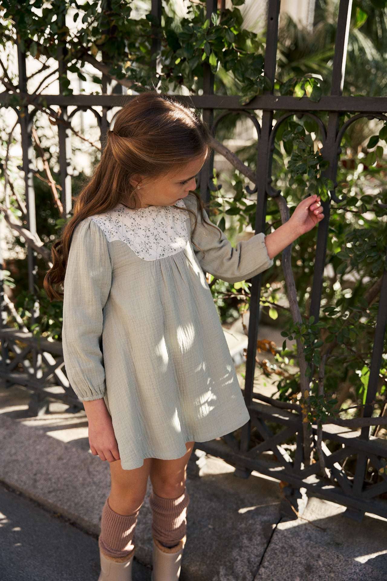 Green muslin girl's dress with floral detail for wholesale on Faire1