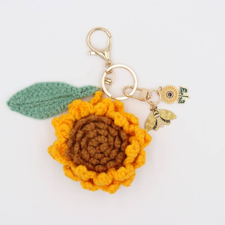 Little Ray of Sunshine: Handcrafted Knit Sunflower with Happy Charms and other Purchase Wholesale sunflower keychain. Free Returns & Net 60 Terms on Faire trending on Faire.