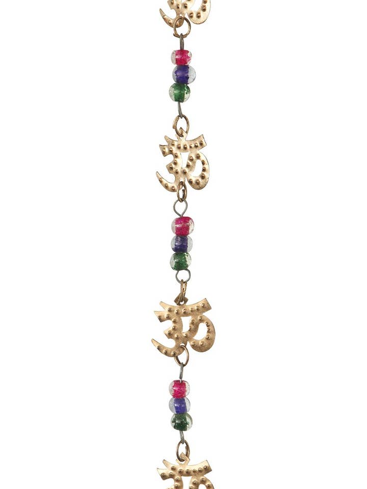 Sieben Om-Symbol Wandbehang mit Glocke für den Großhandel von Buddha Groove