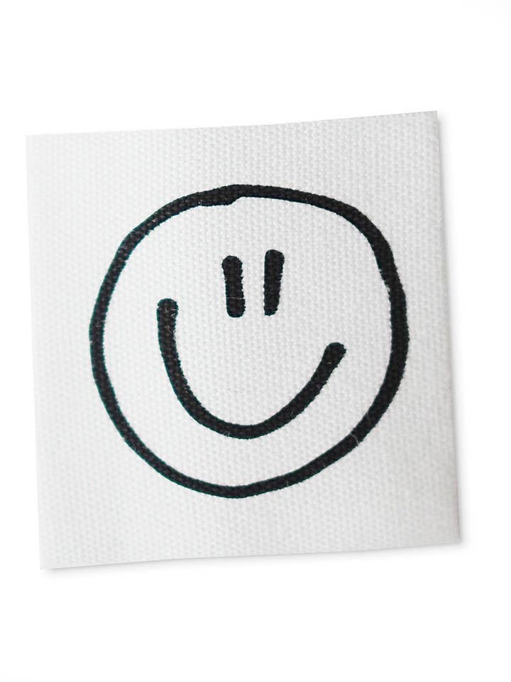 Bomullsetikett *Smile* för wholesale av Paul und Clara