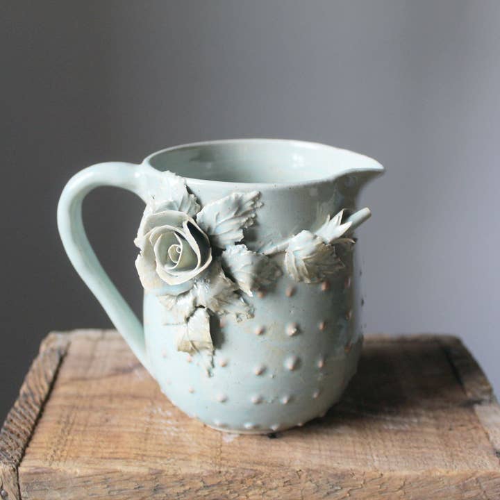 Blue stoneware milk jug / creamer with embossed roses and dots for wholesale by L'Officina