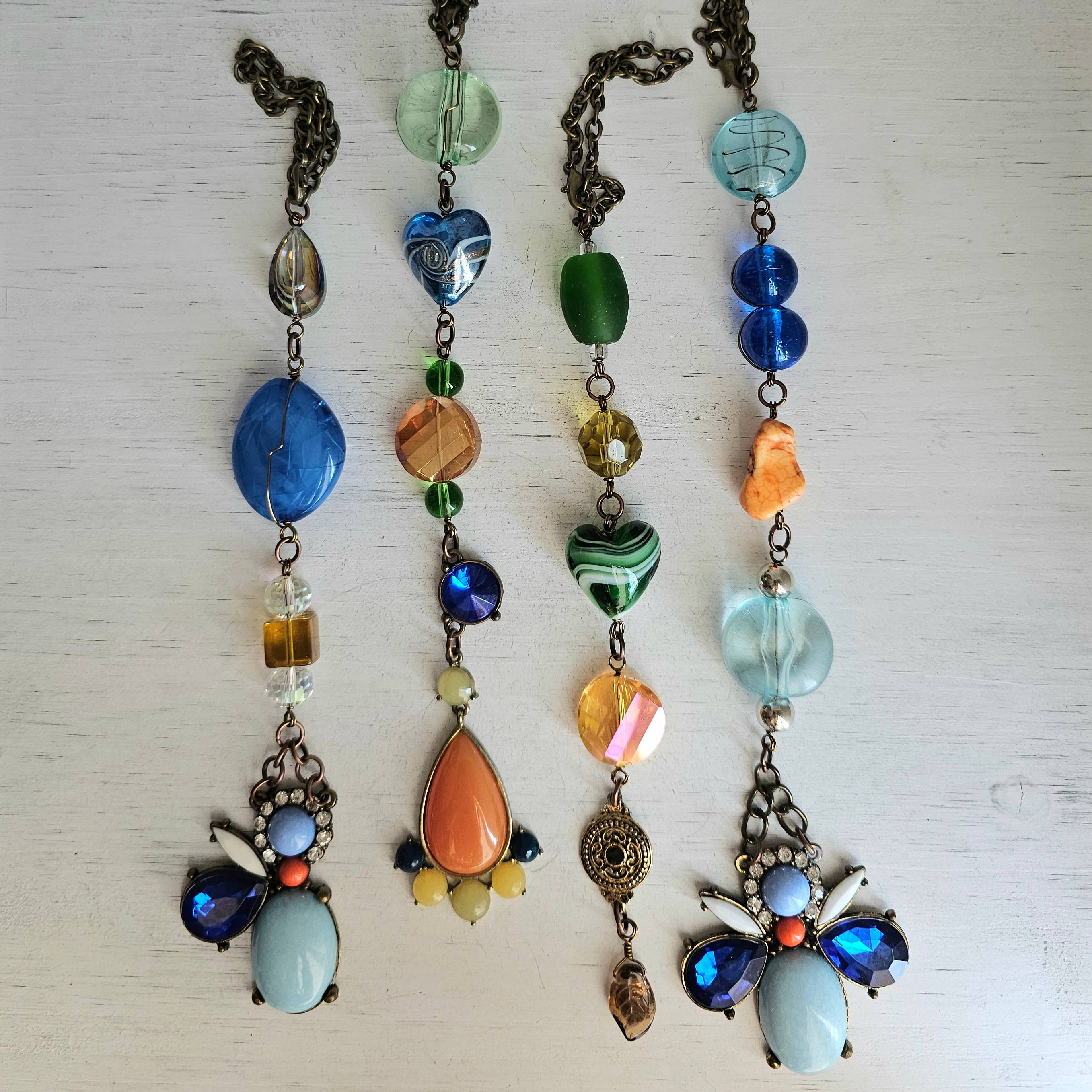 Divine Dragon Designs - Vendita all'ingrosso Acchiappasole - Gioielli vintage in pietra e riciclati, acchiappasoli/tiranti a ventaglio1