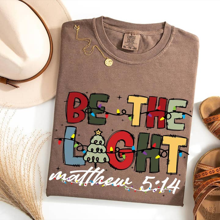 Glaime - Wholesale T-Shirt (Graphic) - Women's - Comfort Colors Be The Light Christmas Shirt, Christian Bible3