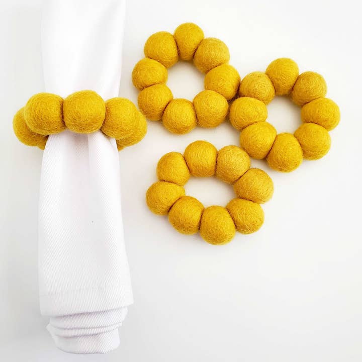 Mustard Wool Felt Handmade Pom-Pom Napkin Rings for wholesale by Global Groove Life