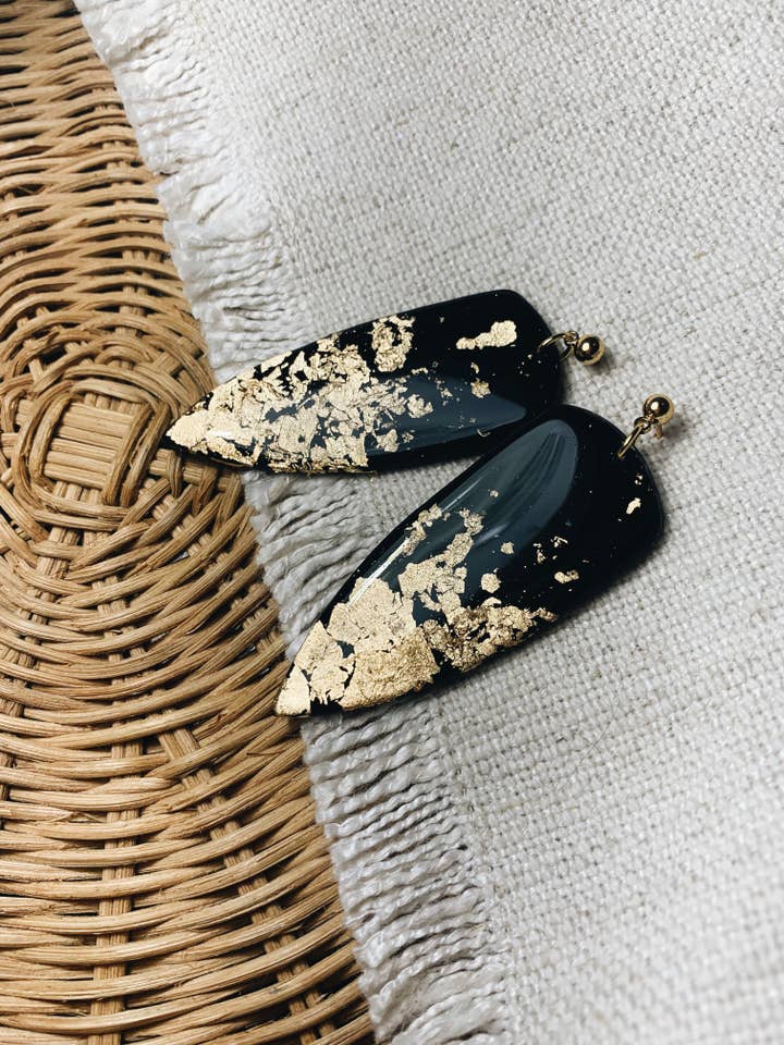 The Black & Gold Dagger Earrings for wholesale by Body & Boho