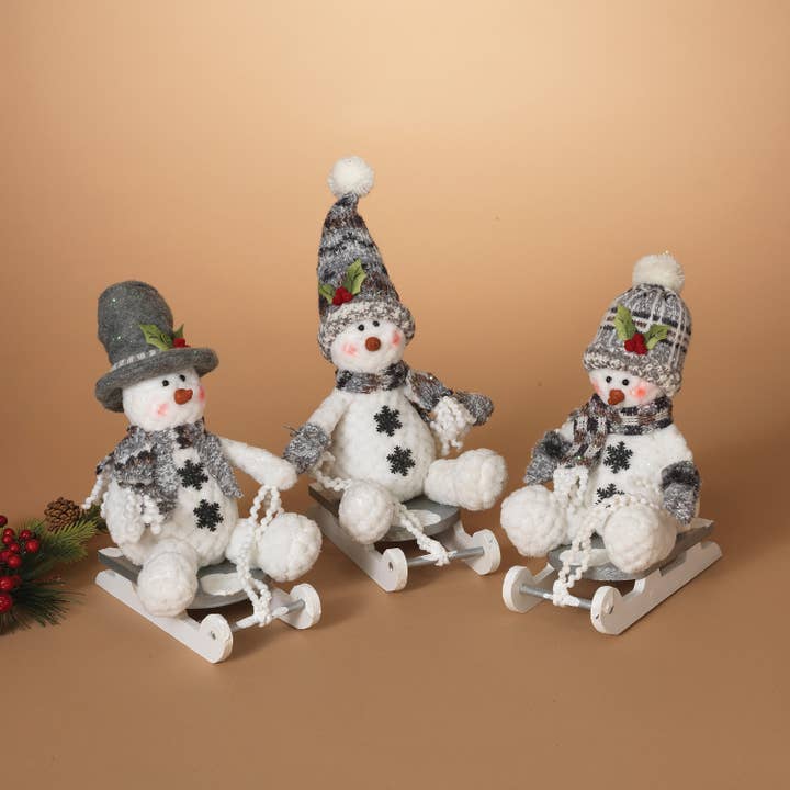 The Gerson Companies - Wholesale Decorative Figurine - 10"H Plush Holiday Snowman on Wood Sled, 3 Asst