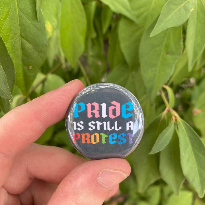 Pride is Still a Protest button for wholesale by Support the T