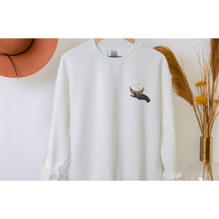 Boho Hand Holding Moon and Stars Crewneck Sweatshirt for wholesale by a riley creations