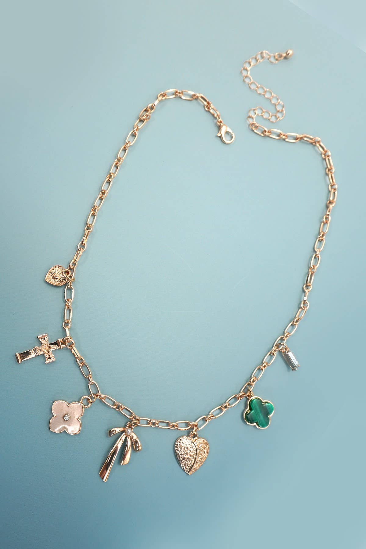 GOLD CHARM NECKLACE-GREEN CLOVER BOW CROSS HEART | 80N91991 for wholesale on Faire1