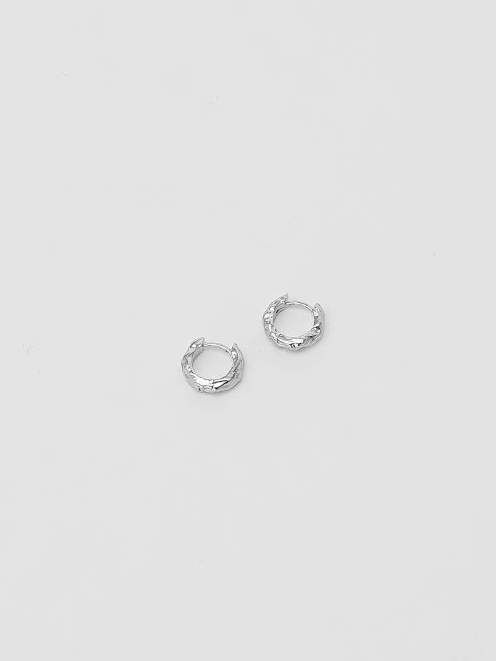 Organic Huggie Hoops in Sterling Silver for wholesale by Wolf Circus Jewelry