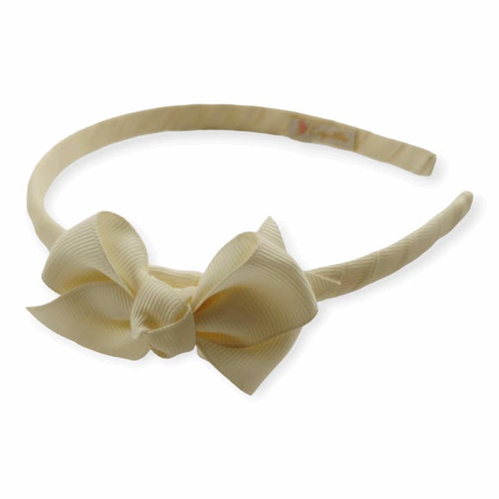Serre-tête nœud papillon pour la vente par Koquitos