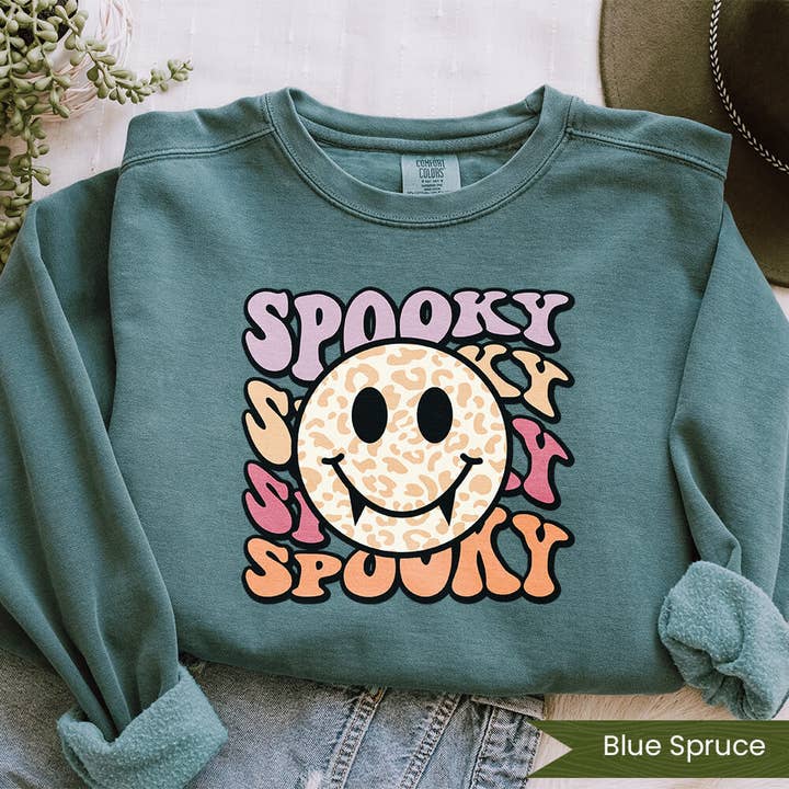 Wildflower Apparel Co. – wholesale Graphic sweatshirt – Women’s – Spooky Vampire Smiley
