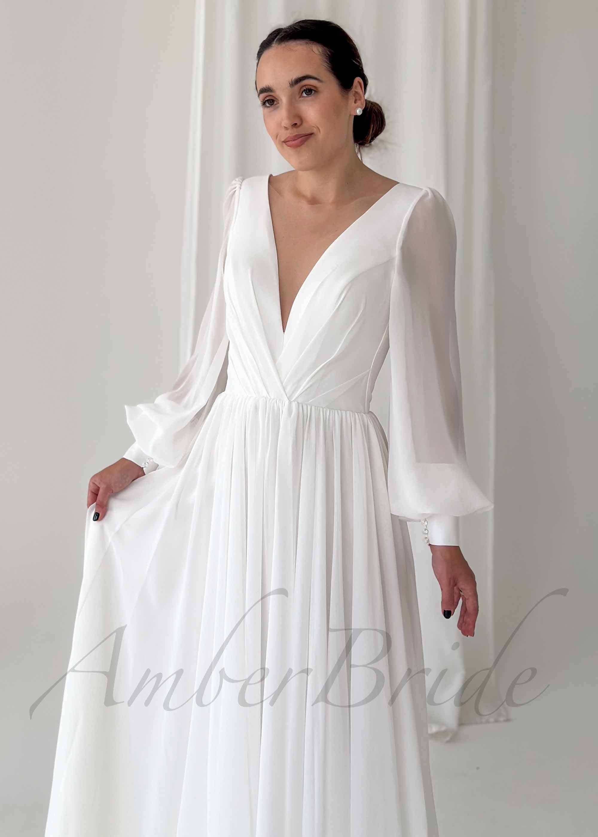 Amber Commerce Group, MB - Wholesale Gown - Women's - Classy A Line Wedding Dress with Deep V Neckline and Long Sleeves1