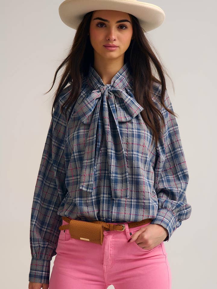 Blue blouse with check print and bow detail at the neck for wholesale by Q2—All Orders:Free Duties for the US,UK,and Canada