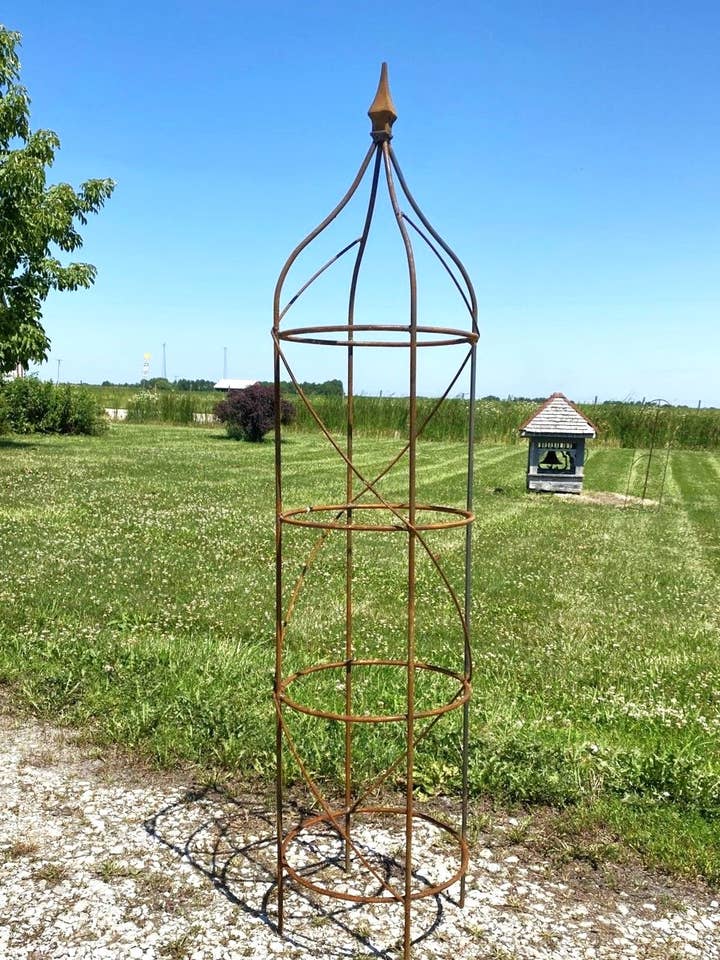 Graduated Sizes of Iron Heavy Round Obelisks with Cast for wholesale by Garden Iron And More