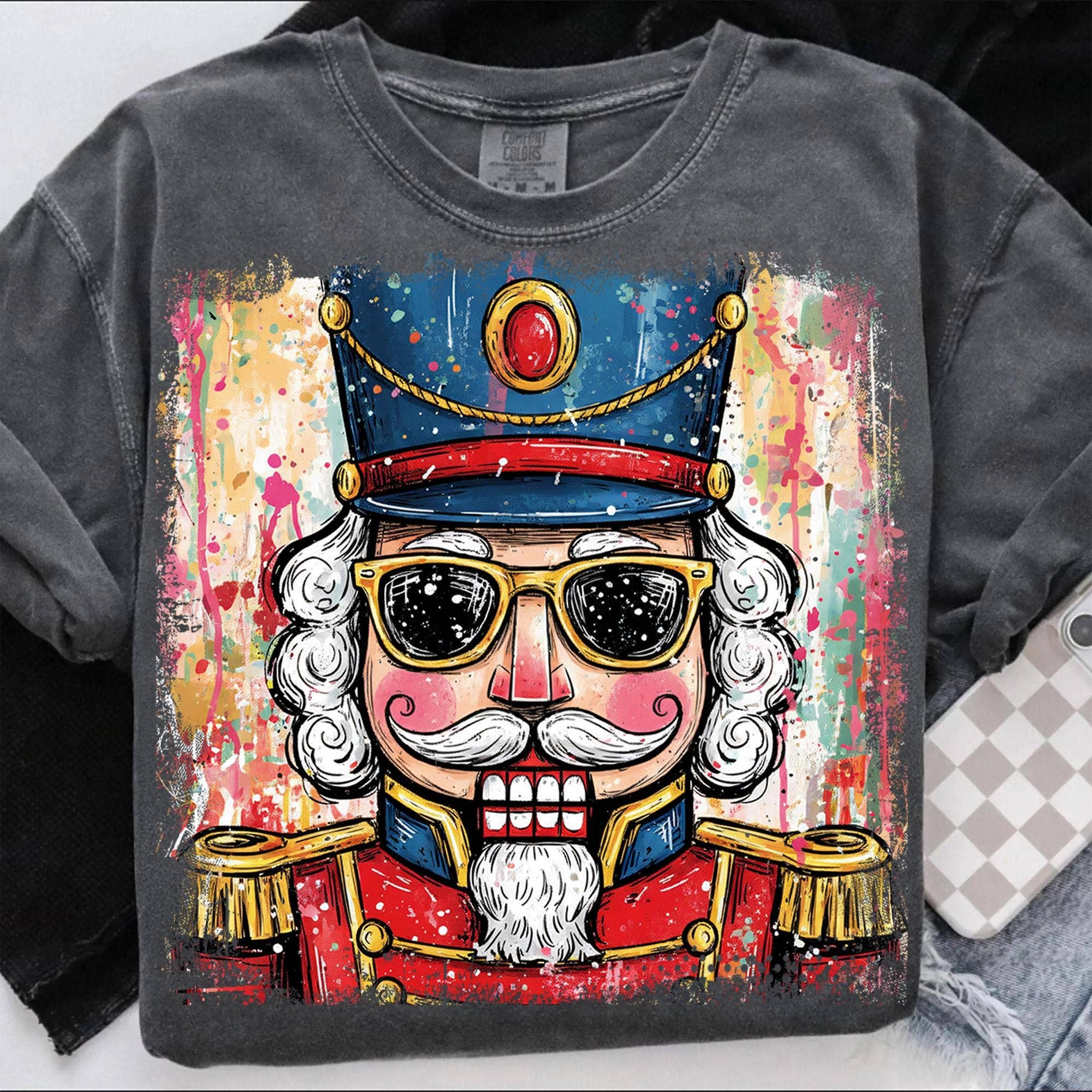 NVC Ecommerce LLC - Vendita all'ingrosso Maglietta stampata - Donna - Maglietta Schiaccianoci di Natale, Felpa con schizzi a pennellate1