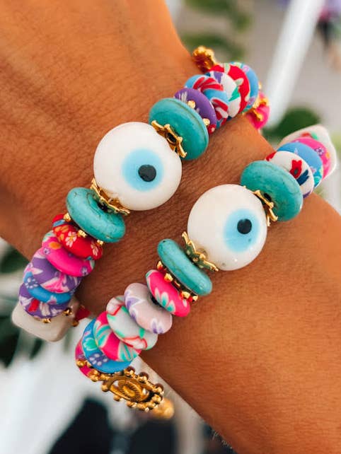 Multi colored eye bracelet with gold details for wholesale by Goupi