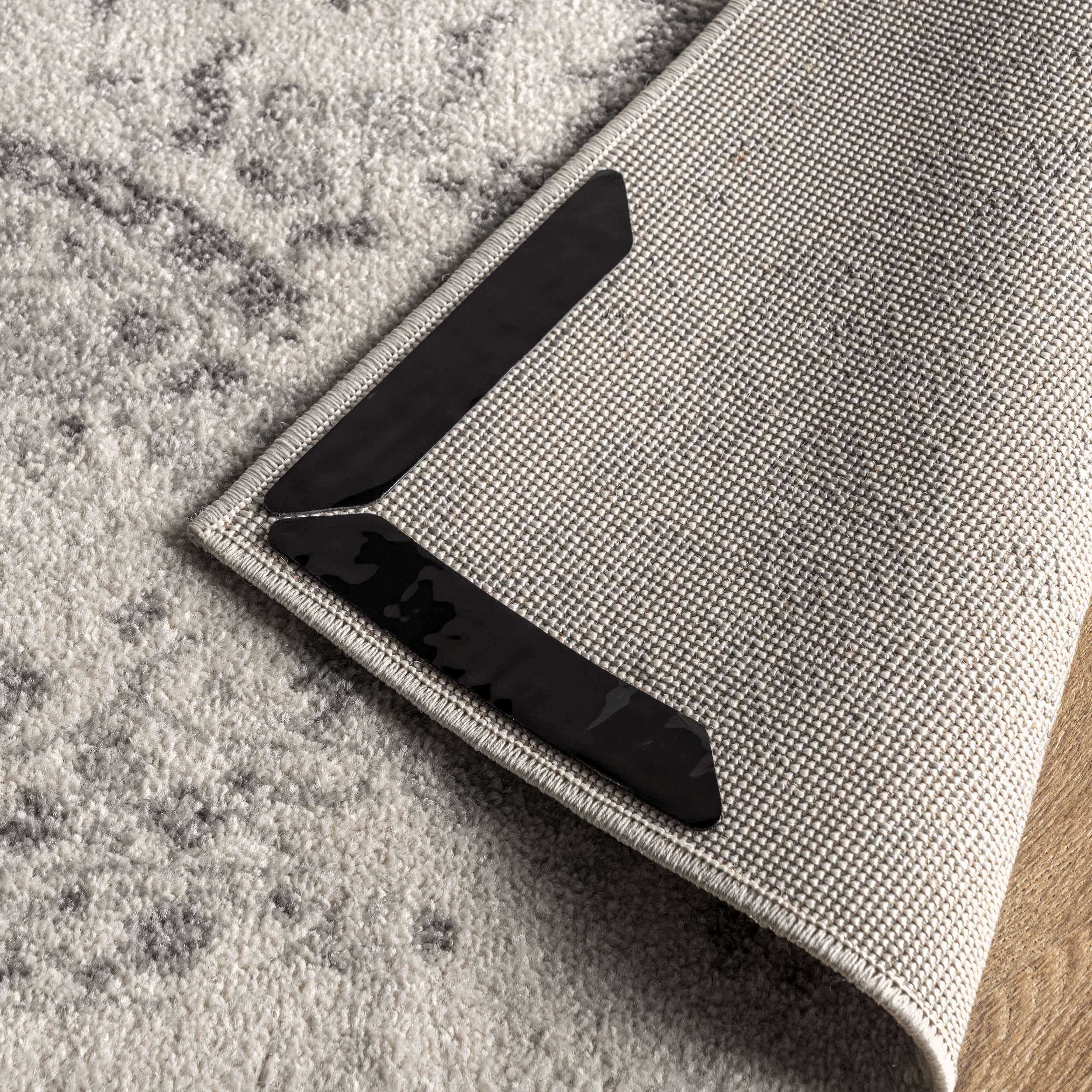Black Corner Rug Grippers for wholesale on Faire2