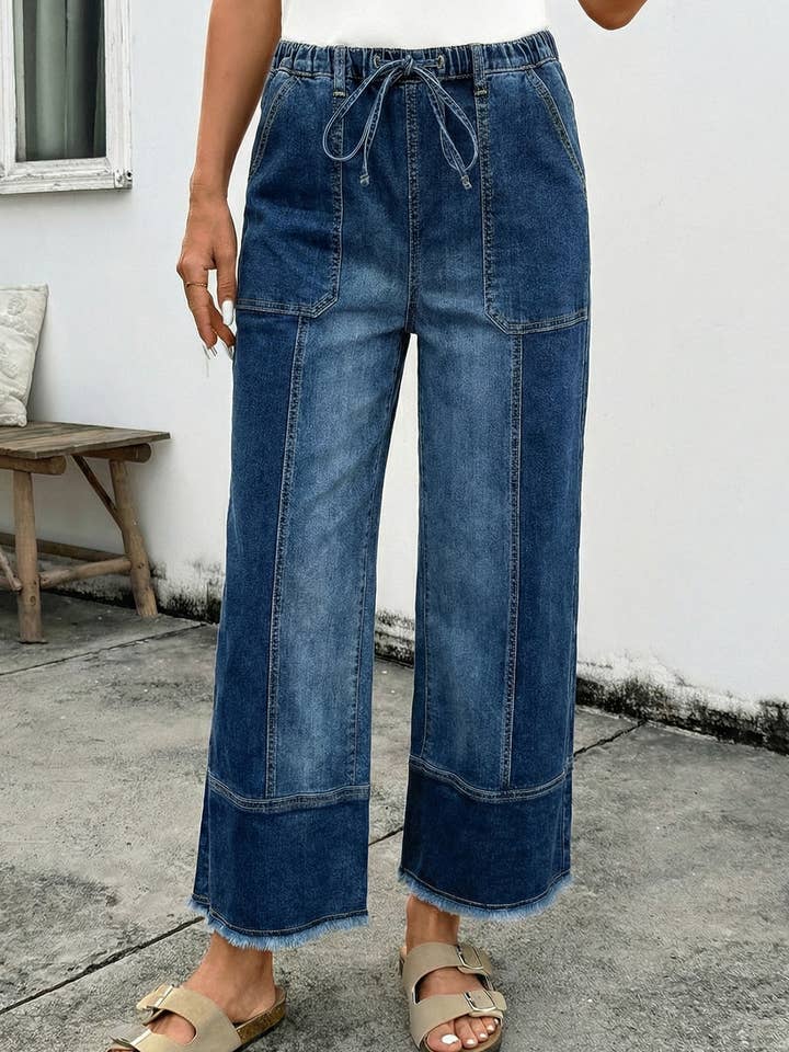 Pantalon en denim à jambes larges avec cordon de serrage, détail de couture et ourlet brut pour la vente par 1 the Woman
