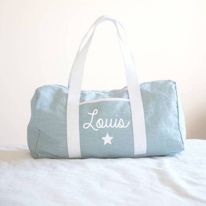 Personalized mint linen weekend bag with star symbol for wholesale by oh la la paris