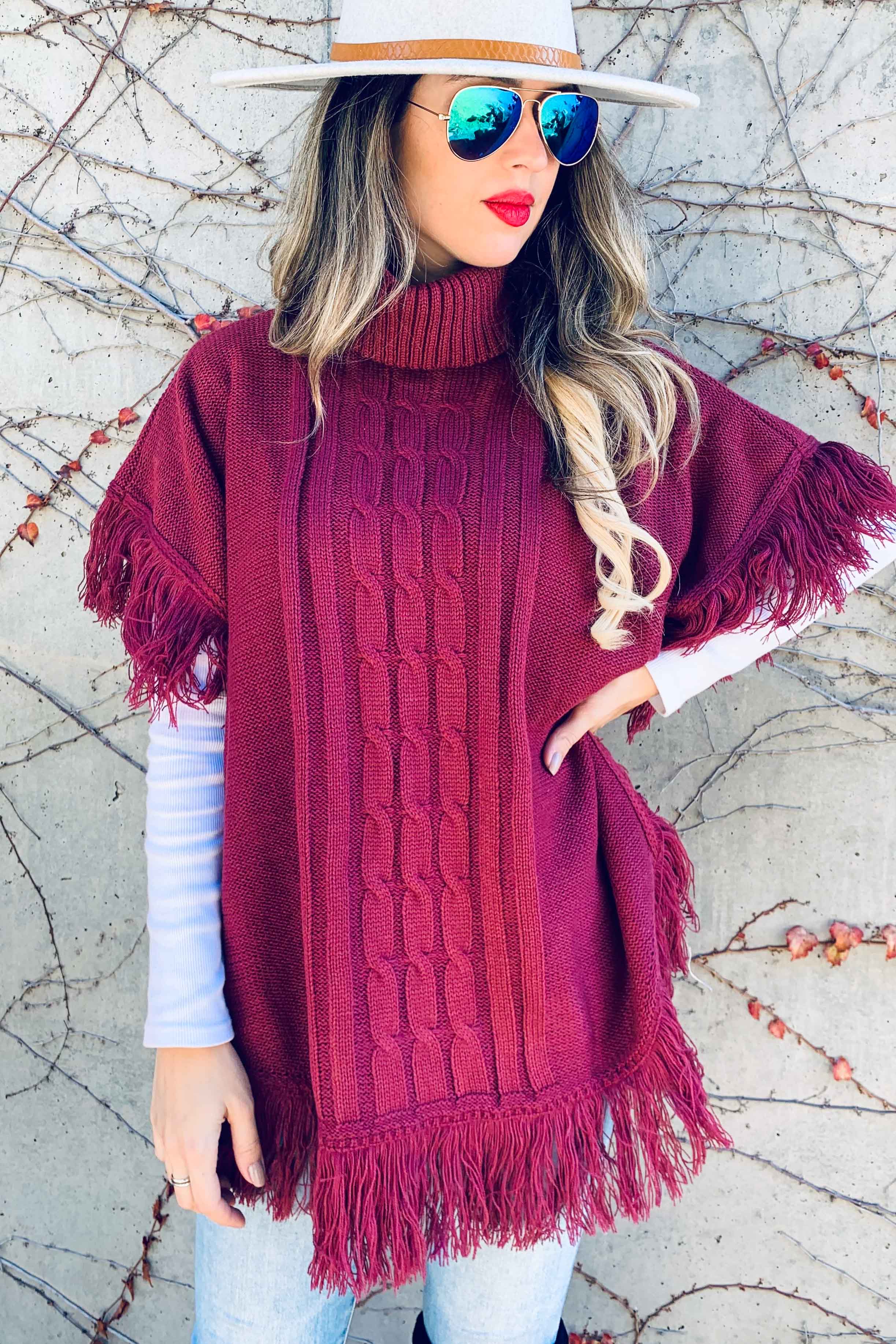 Berry Poncho a tunica in maglia a tunica con frange Berry in vendita all'ingrosso su Faire6