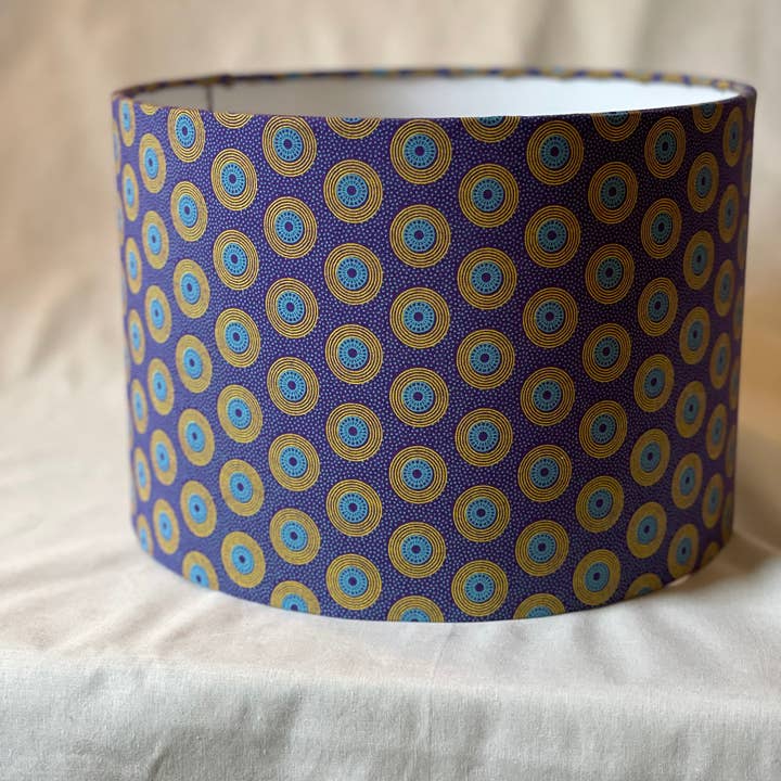 Olive and Limpet - Wholesale Lamp Shade - 10 inch Drum Lampshade. Dynamic South African Shwe Shwe Print- Purple with Teal and Yellow "LP" Motif