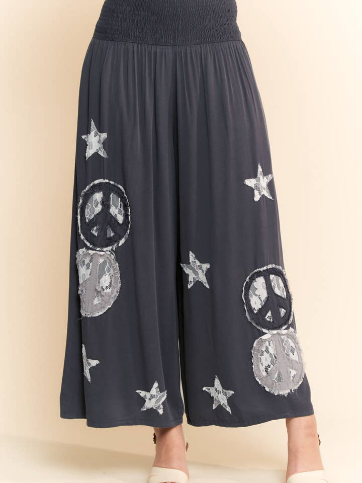 Charcoal PEACE AND STAR PATCHWORK LEG PANTS for wholesale on Faire0