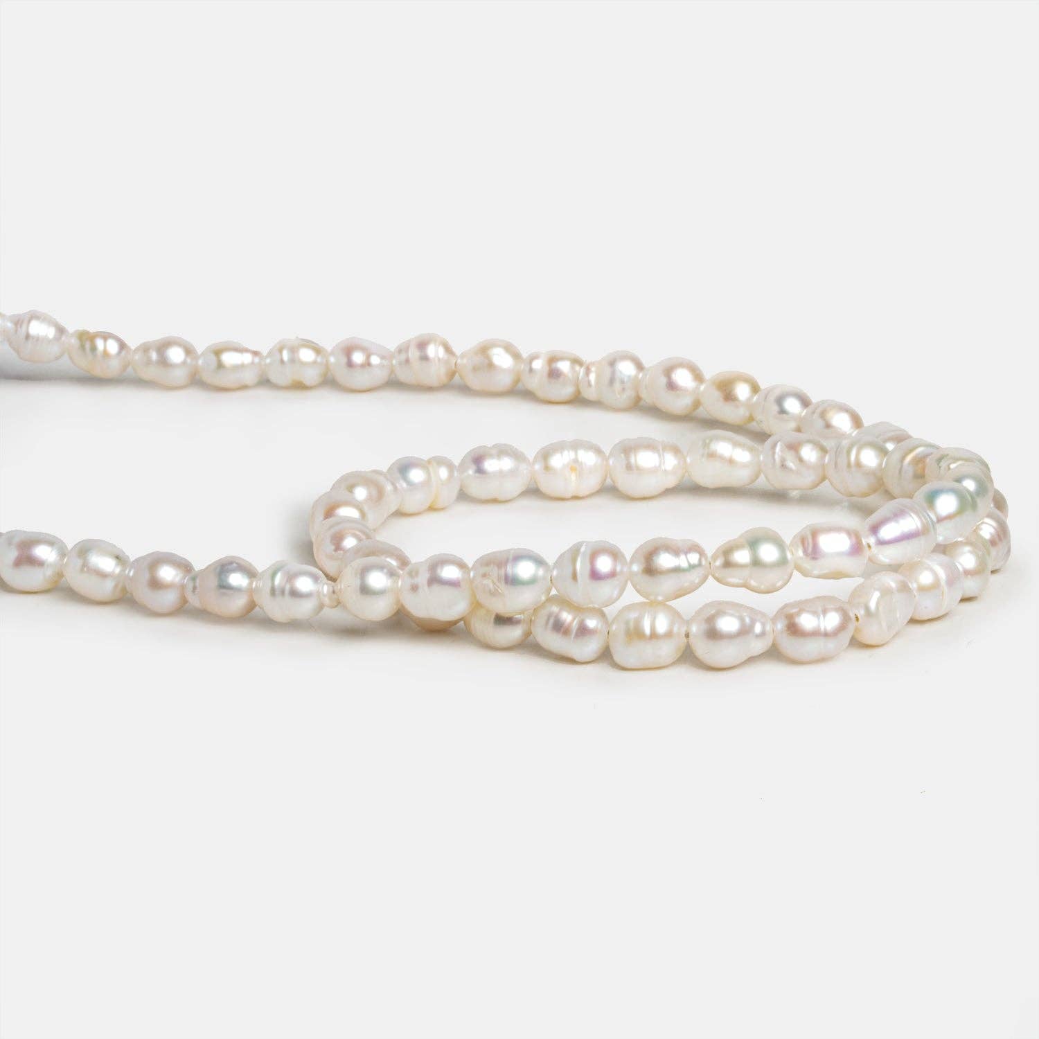 The Bead Traders - Wholesale Beads - 7x5mm Cream Petite Baroque Pearls 15 inch 53 beads1