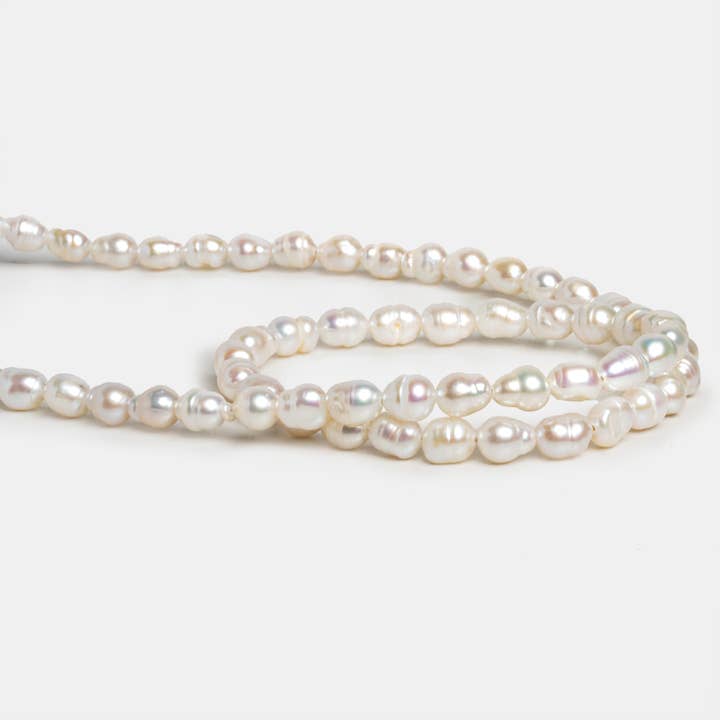 The Bead Traders - Wholesale Beads - 7x5mm Cream Petite Baroque Pearls 15 inch 53 beads1