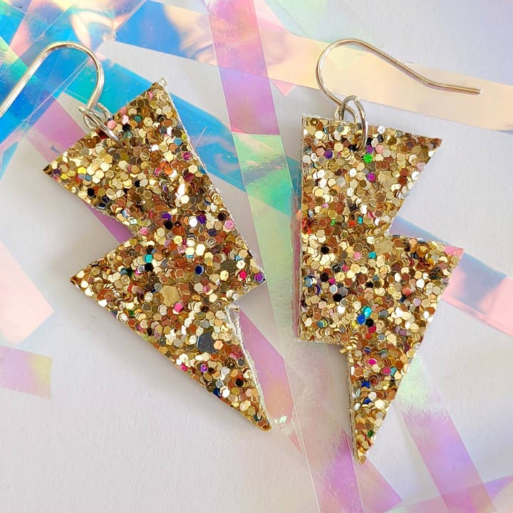 Small Crushed Pearl Gold Glitter Lightning Bolt Earrings for wholesale by All The Discos
