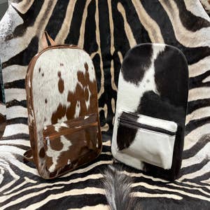 Cowhide & Lace Boutique - Adorable Cowhide backpack purses🐮💕 $95.00 3  left, grab quickly! Email/ship or pickup *cowhide colors slightly vary*