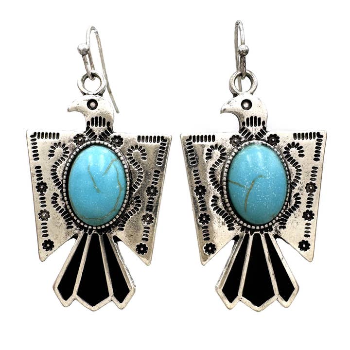 Boucles d'oreilles pendantes en métal avec pierre turquoise et motif Thunderbird pour la vente par Lunar Deer