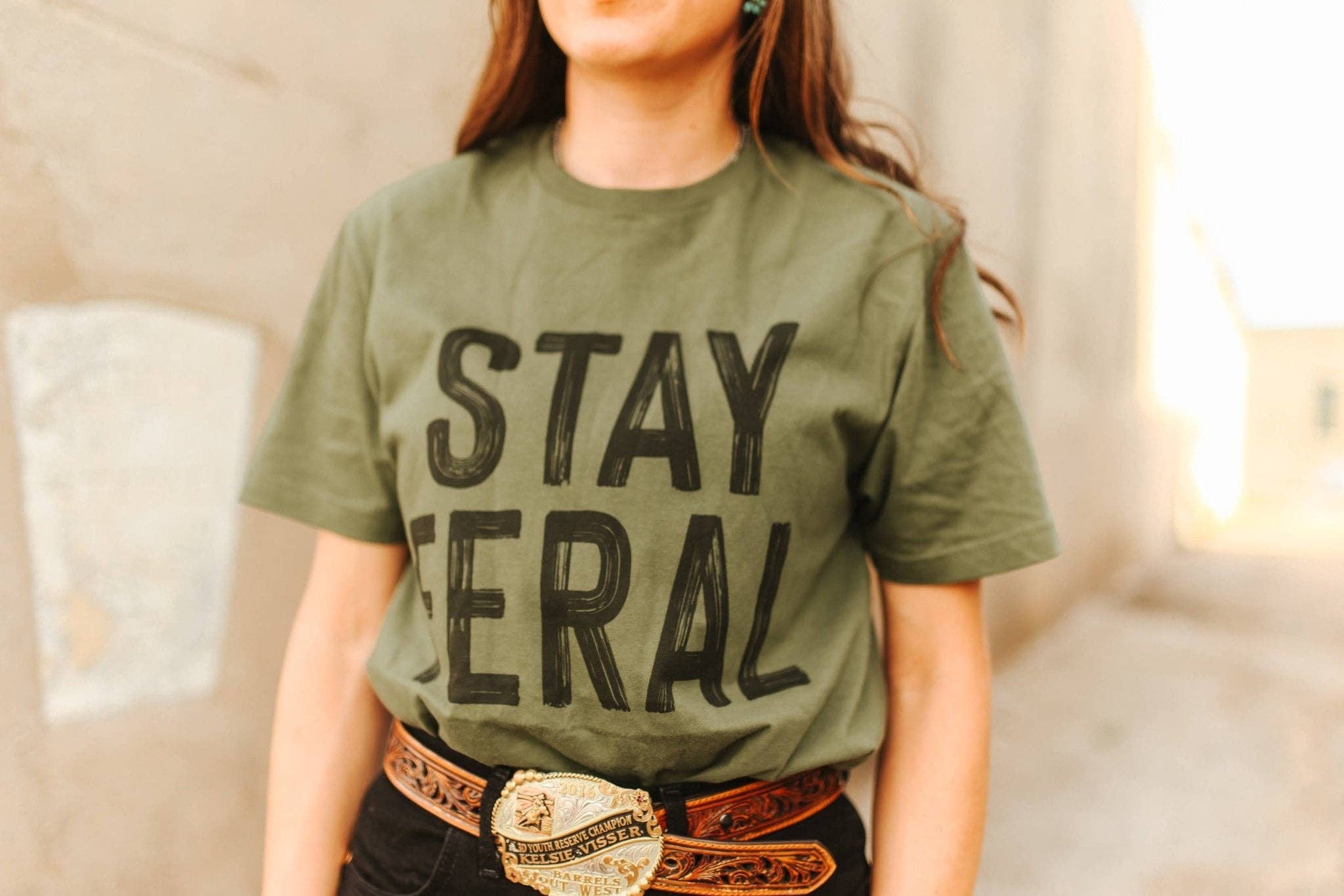 Military Green Stay Feral Graphic Tee for wholesale on Faire3