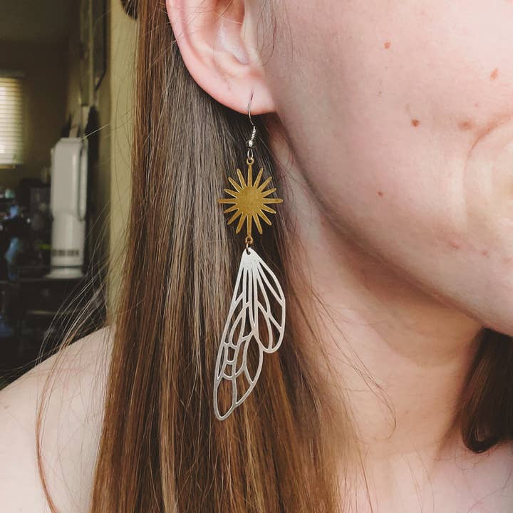 The Sun and the Skies Winged Dangly Earrings for wholesale by Copper Bug Jewelry