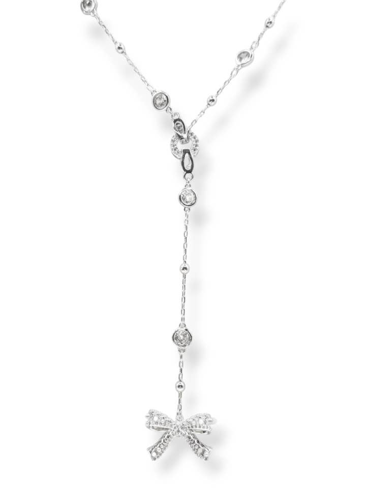 Ryan Crystal and Pearl Bow Charm Lariat Necklace for wholesale by Ariel Taub