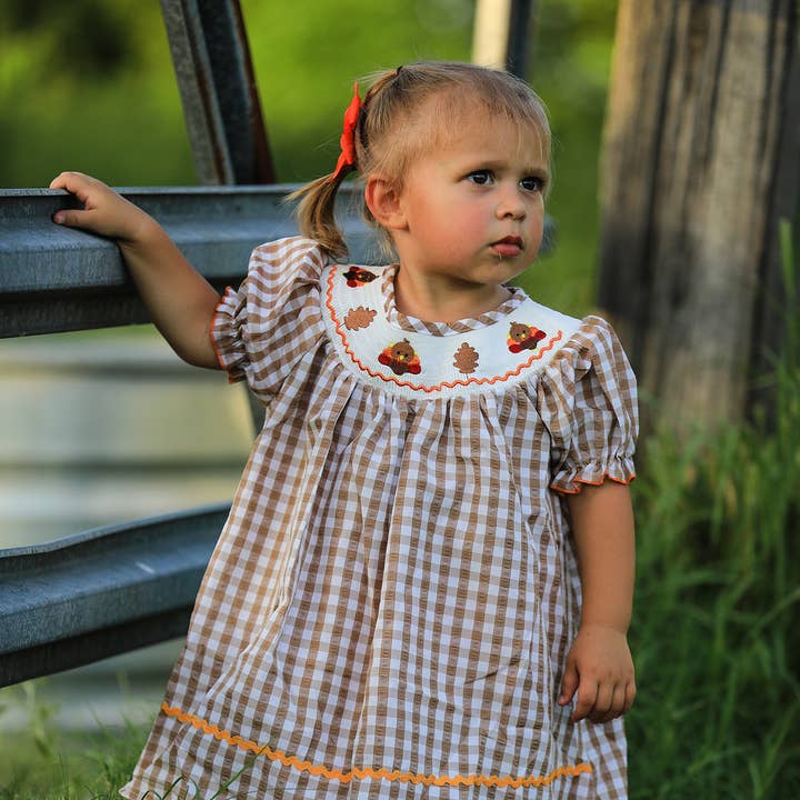 Girls Thanksgiving Smocking Embroidered Brown Plaid Dress and other Purchase Wholesale honey and me. Free Returns & Net 60 Terms on Faire trending on Faire.