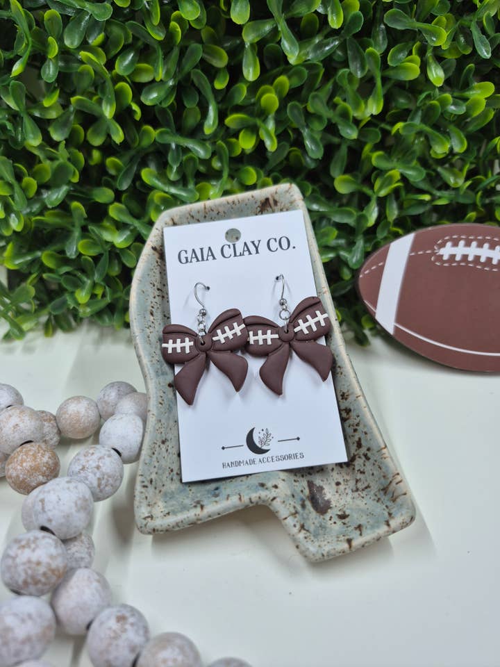 Football bow dangles for wholesale by Gaiaclayco