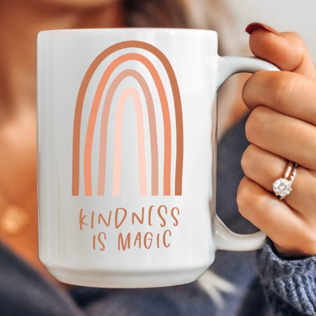15 oz Kindness is Magic Rainbow Ceramic Coffee Mug for wholesale by Amber Marie Design