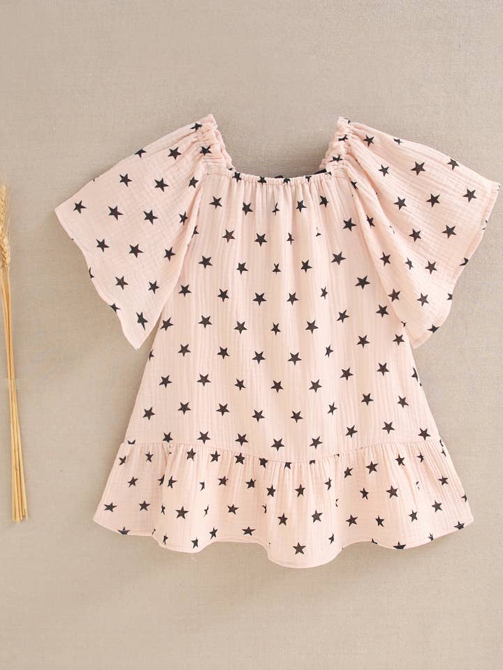 Abito da bambina rosa pallido con stelle nere per la vendita all'ingrosso da parte di Dadati