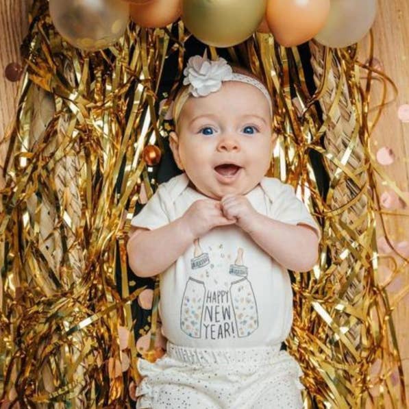 New Years baby graphic organic bodysuit | poppin bottles for wholesale by Finn + Emma