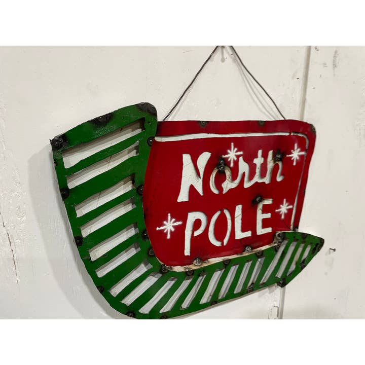 RÄUMUNGSVERKAUF-Nordpol Metallschild-Weihnachten-43x53 cm-18 $ für den Großhandel von My Amigos Imports