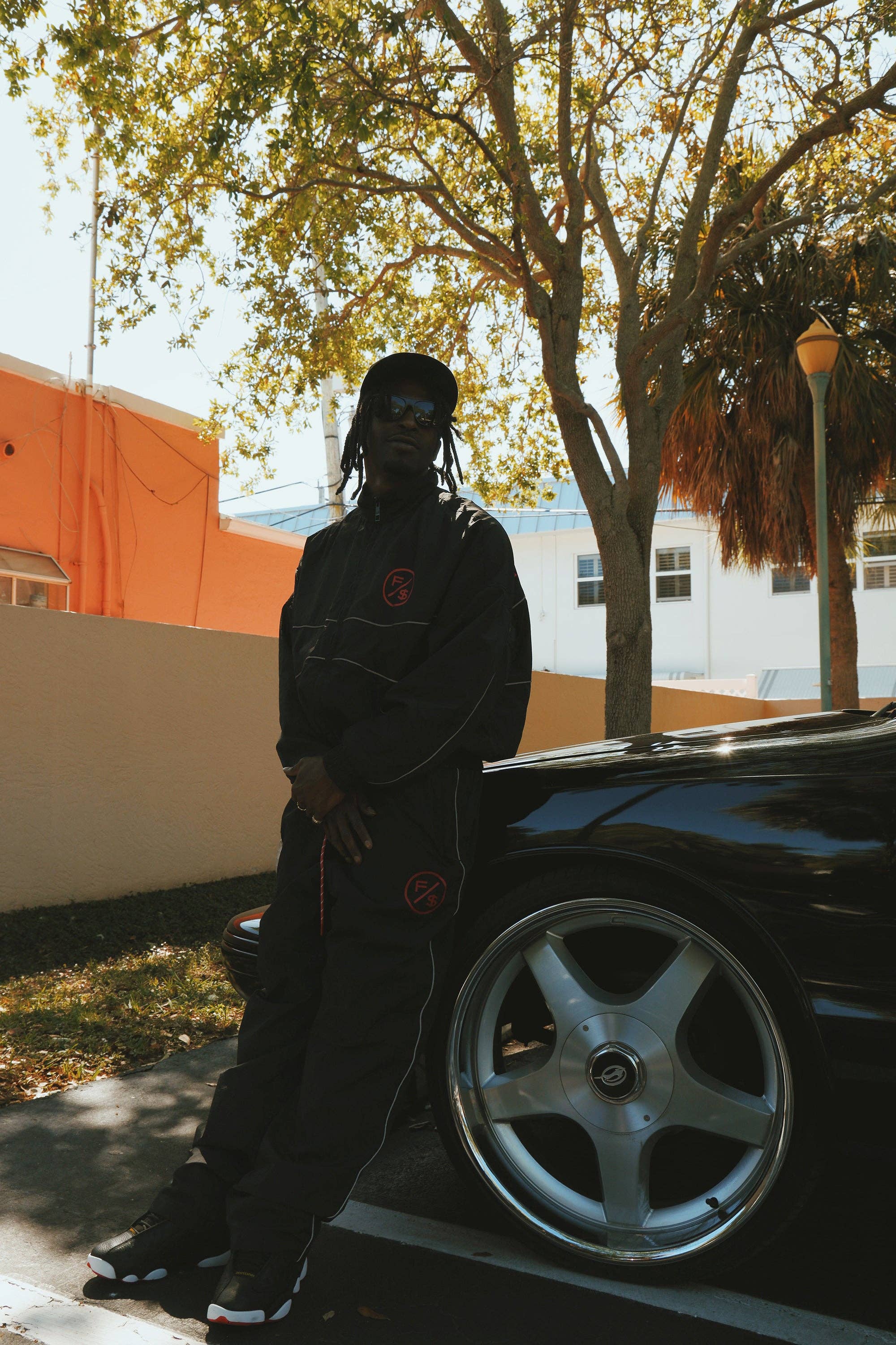 Black Red MOTION Nylon Pants (BRED) for wholesale on Faire12